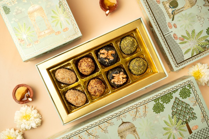 Purnah sweets in a gold gift box